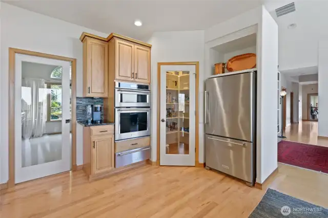 Kitchen has a walk in pantry and pocket door to dining room.