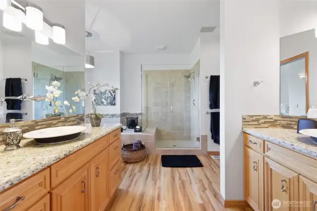 Large Primary bathroom with two vanities, soaking tub and walk in shower.