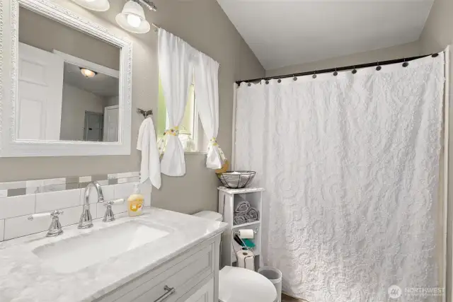 How Charming is this Full Bath? Complete with New Marble Top Vanity!