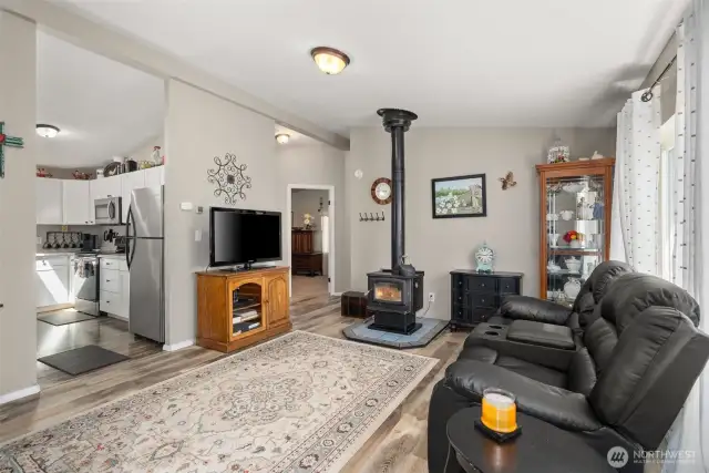 Step Inside to Easy Care Laminate Floors, a Cozy Wood Burning Fireplace, and Vaulted Ceilings!