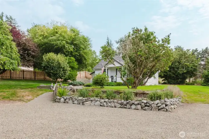 A graveled drive entry welcomes you and your guests to this private oasis.