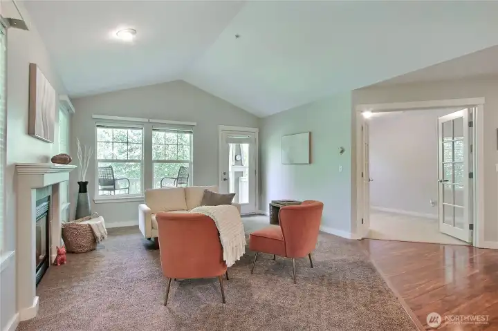 Vaulted ceilings and a cozy gas fireplace provide a warm spacious vibe.