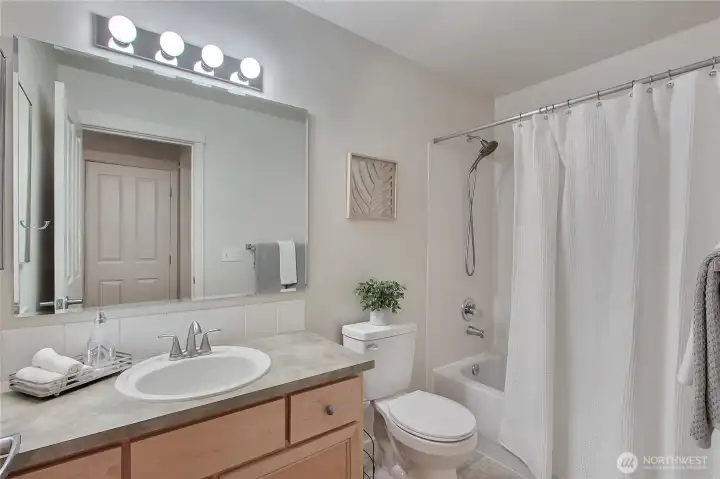 Hall full bath with new toilet.