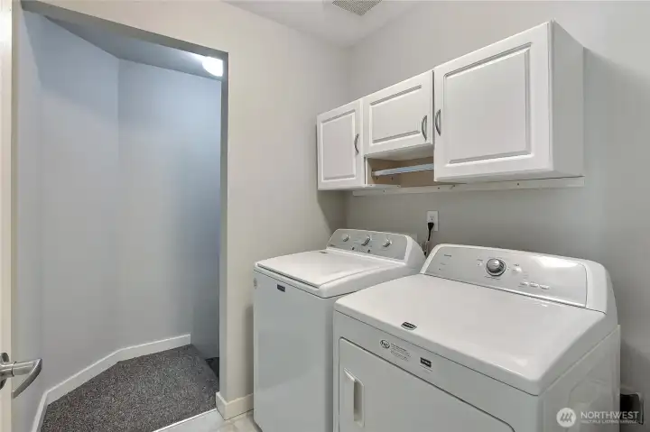 Laundry room and stairs to garage.