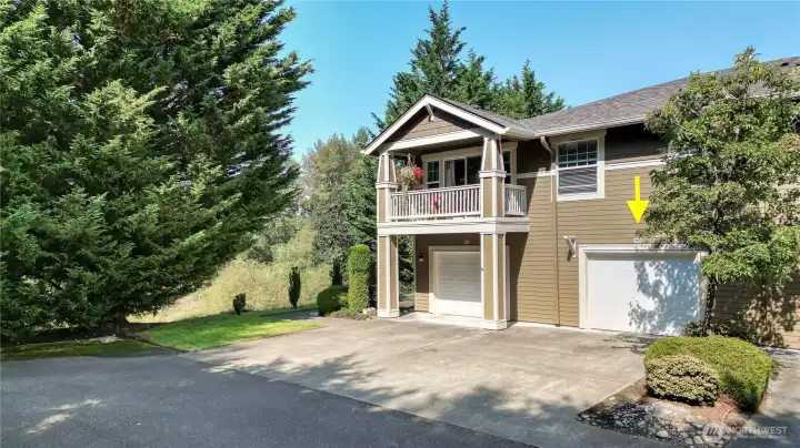 Garage on right hand side belongs to the condo plus parking for 1 vehicle outside.  And street parking is available as well.