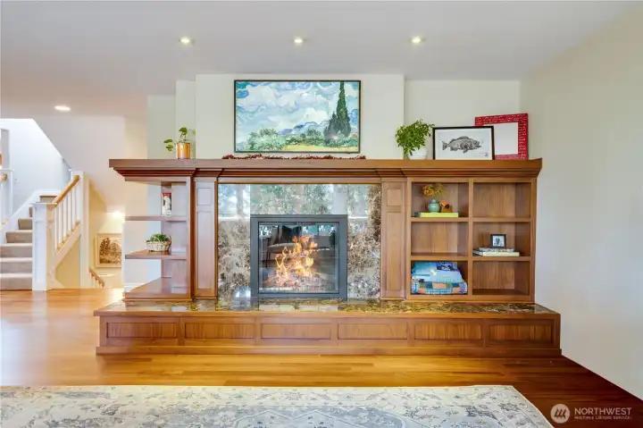 Built-ins and a wide hearth surround the gas fireplace with a wraparound mantel above. Along with the fireplaces, a brand new boiler keeps the whole house cozy.