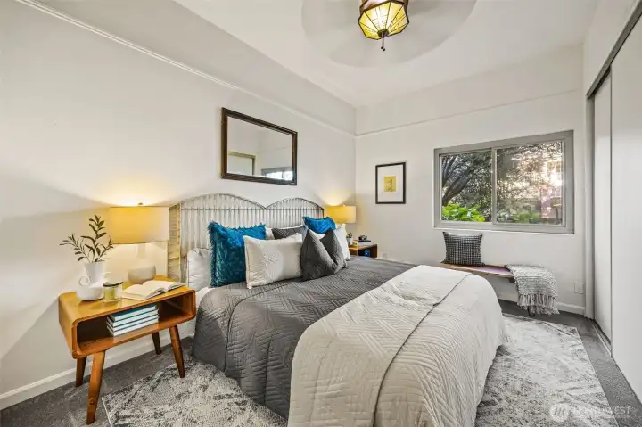 Spacious primary bedroom fits king-sized bed.