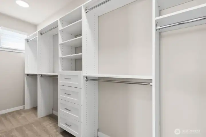 Love this built in closet system in the primary bedroom walk in closet!