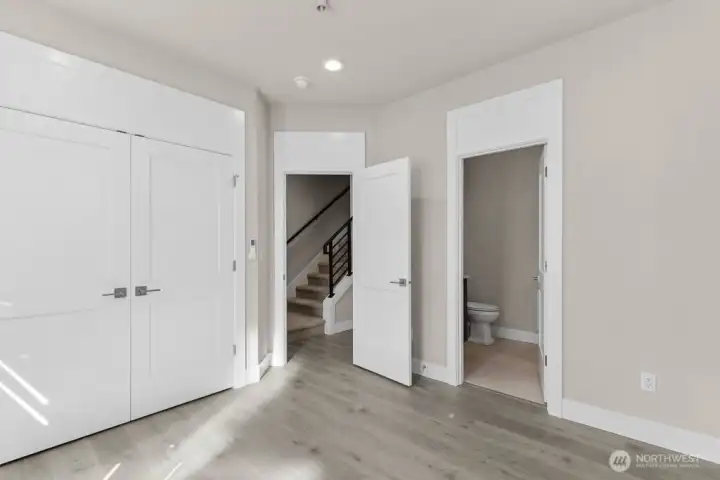 Lower-level bedroom/office has a large walk-in closet adn own 3/4 bathroom! Plus a private entrance