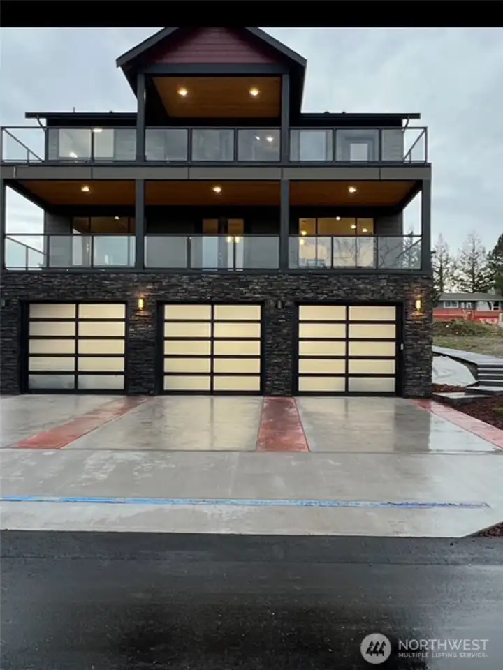 Back of home with 3 car oversized garage