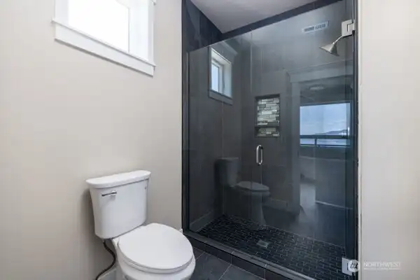 tiled shower in Primary Bath