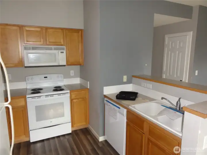 Good sized kitchen with plenty of cabinets and counterspace.