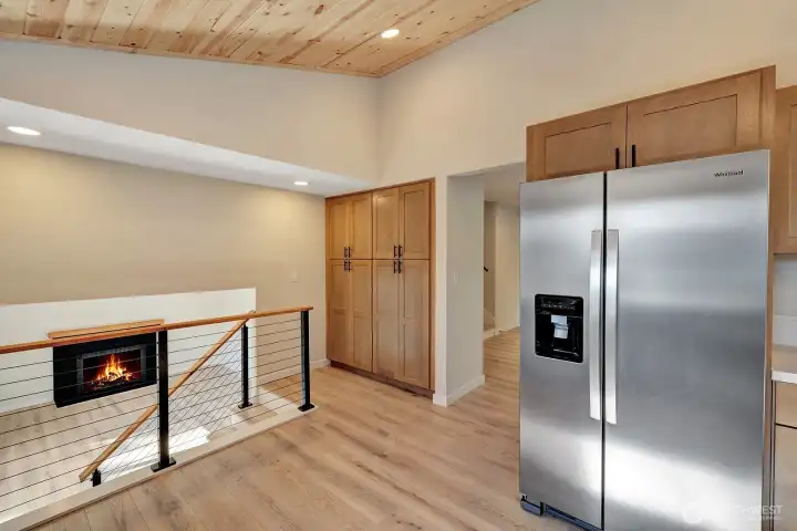 Large built in pantry cabinetry along side the new modern railings!