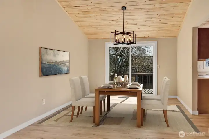 Large dining room off of kitchen and has direct access to upper portion of deck. Virtually staged