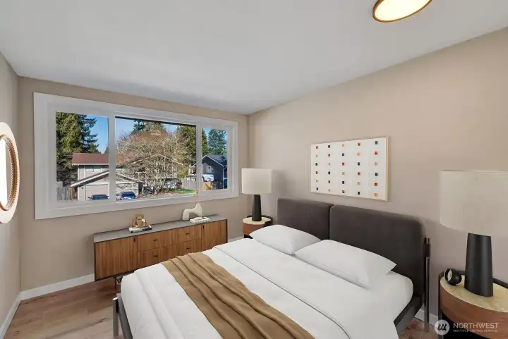 2nd bedroom upstairs has tons of natural light! Virtually staged