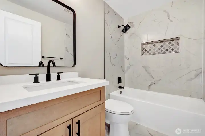 Elegant full bath perfectly placed in between all bedrooms upstairs!