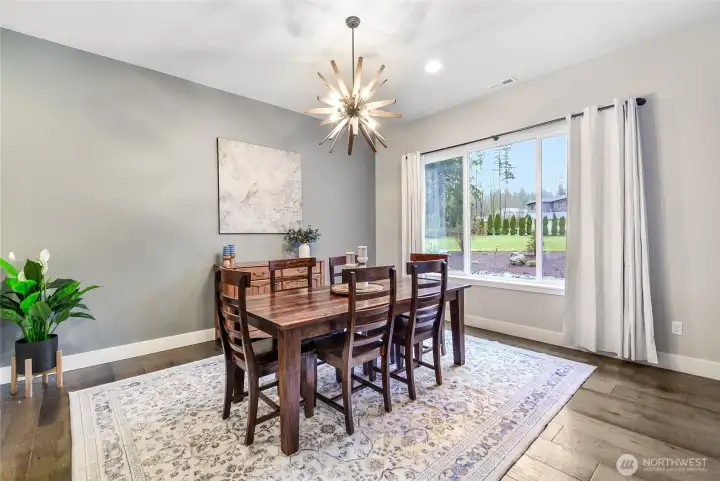 Lovely dining room is large and looks out to the backyard!
