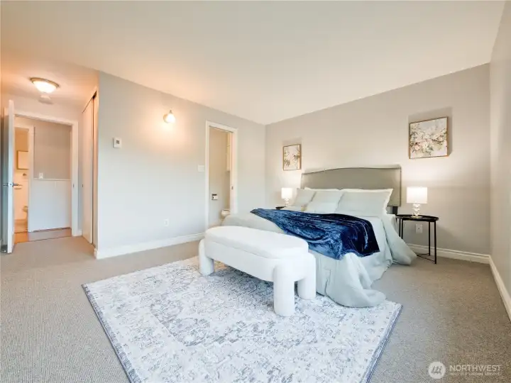 Wake up to soft morning light in this spacious, tranquil bedroom that offers a peaceful escape from the city’s pace.