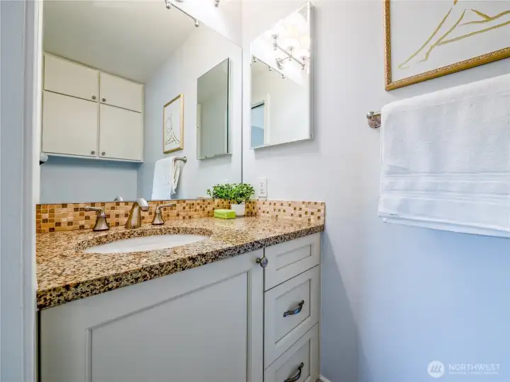 A half bath showcases thoughtful updates and a clean, modern finish.