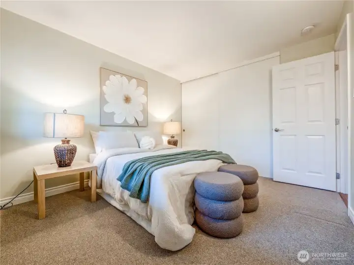 A flexible second bedroom adapts effortlessly as a guest suite, office, or creative space.