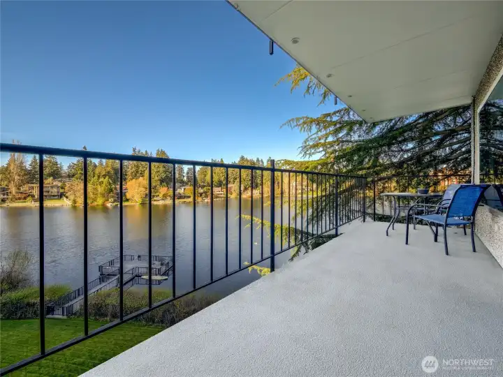 The covered balcony extends your living space year-round with fresh air and calming water views.