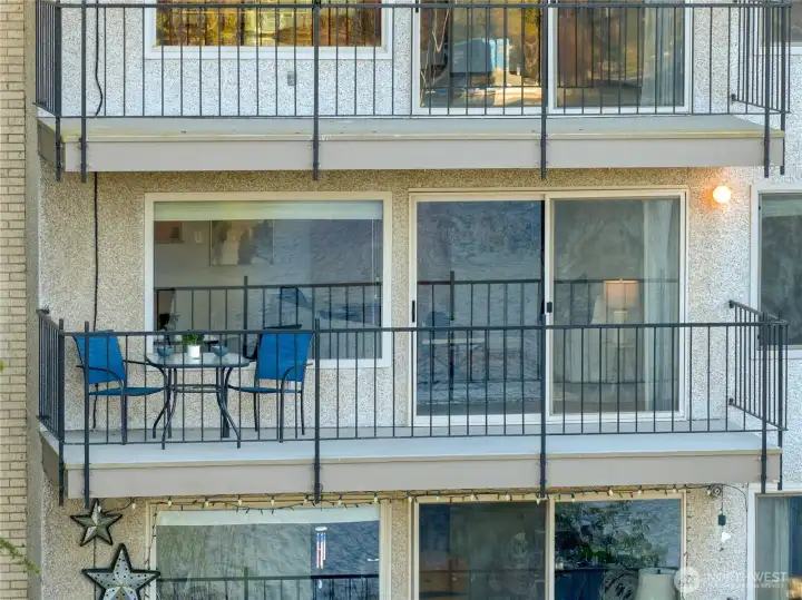 An expansive lakefront deck offers the perfect blend of vacation ambiance and serene relaxation, ideal for morning coffee or evening wine.