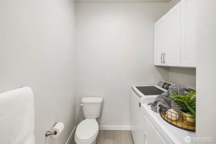 Guest bath on main floor doubles as laundry room