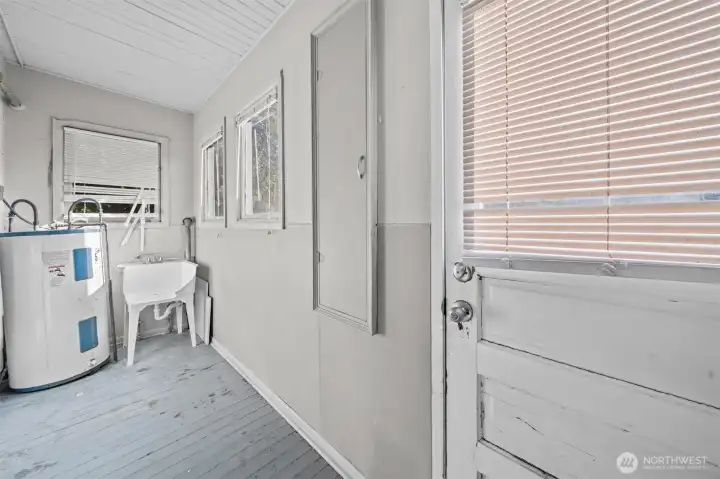 Laundry room that leads to back yard