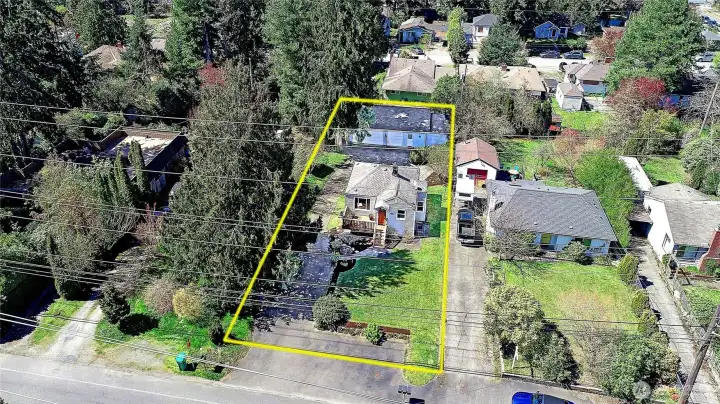 Aerial view facing West showing approximate boundary lines.