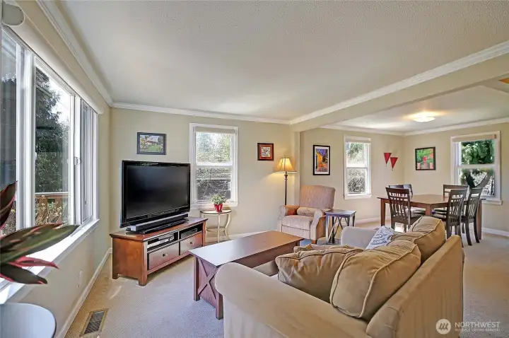 The family room is naturally bright and open offering a space for a variety of furniture arrangements.