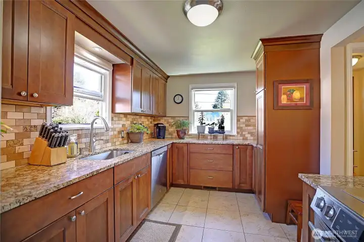 Enjoy cooking dinner in your custom kitchen with a lot of cabinet space for storing all your kitchen gadgets.