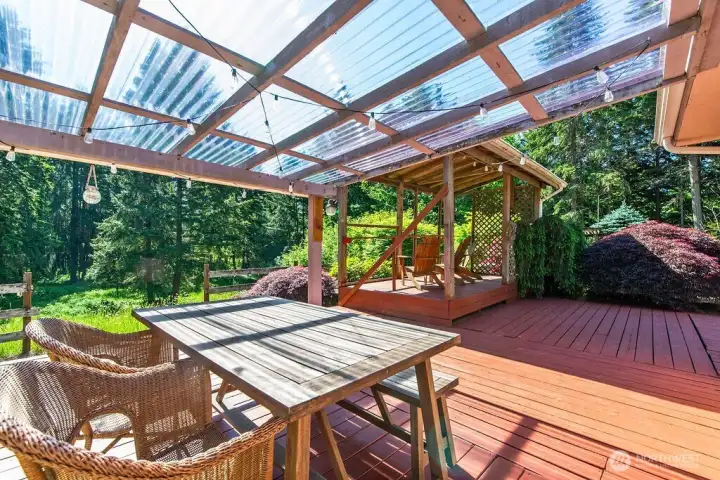 Expansive back deck perfect for enjoying the beauty of the property or entertaining.