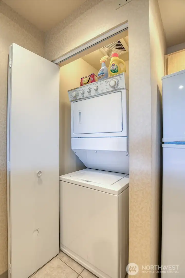 stacking washer and dryer is tucked away stacking washer and dryer is tucked away