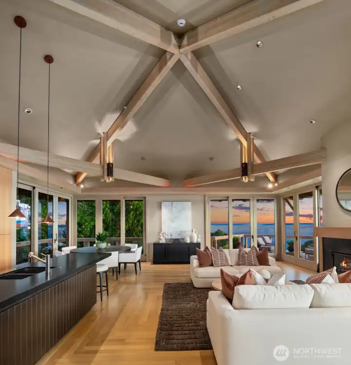 The materials selected throughout the home are equally elevated. Select vertical grain fir, select white oak flooring and cabinetry, travertine marble, slate, copper, granite, and expansive walls of glass create interiors of warmth and authenticity. Handcrafted copper lighting by renowned artisan John Giese serves as both sculpture and illumination, while custom millwork and built-in cabinetry reflect a level of craftsmanship rarely encountered in contemporary construction. The materials selected throughout the home are equally elevated. Select vertical grain fir, select white oak flooring and cabinetry, travertine marble, slate, copper, granite, and expansive walls of glass create interiors of warmth and authenticity. Handcrafted copper lighting by renowned artisan John Giese serves as both sculpture and illumination, while custom millwork and built-in cabinetry reflect a level of craftsmanship rarely encountered in contemporary construction.
