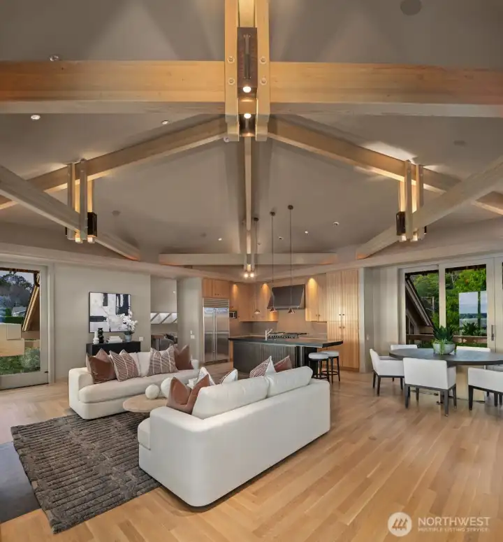 The materials selected throughout the home are equally elevated. Select vertical grain fir, select white oak flooring and cabinetry, travertine marble, slate, copper, granite, and expansive walls of glass create interiors of warmth and authenticity. Handcrafted copper lighting by renowned artisan John Giese serves as both sculpture and illumination, while custom millwork and built-in cabinetry reflect a level of craftsmanship rarely encountered in contemporary construction. The materials selected throughout the home are equally elevated. Select vertical grain fir, select white oak flooring and cabinetry, travertine marble, slate, copper, granite, and expansive walls of glass create interiors of warmth and authenticity. Handcrafted copper lighting by renowned artisan John Giese serves as both sculpture and illumination, while custom millwork and built-in cabinetry reflect a level of craftsmanship rarely encountered in contemporary construction.