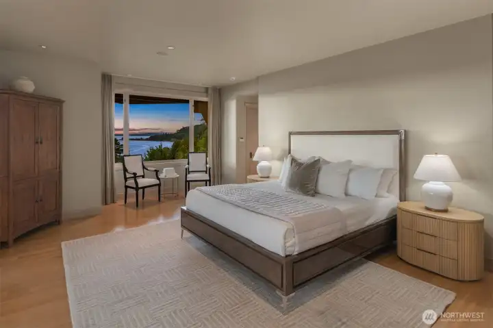 Occupying its own dedicated wing, the primary suite is among the residence's most remarkable spaces. Expansive windows frame unobstructed views across Puget Sound, Bainbridge Island, and the Olympic Mountains, creating a backdrop that changes continuously throughout the day. Morning light dances across the water while ferries traverse the horizon. As evening approaches, sunsets unfold directly beyond the windows, filling the room with extraordinary color and warmth. Occupying its own dedicated wing, the primary suite is among the residence's most remarkable spaces. Expansive windows frame unobstructed views across Puget Sound, Bainbridge Island, and the Olympic Mountains, creating a backdrop that changes continuously throughout the day. Morning light dances across the water while ferries traverse the horizon. As evening approaches, sunsets unfold directly beyond the windows, filling the room with extraordinary color and warmth.