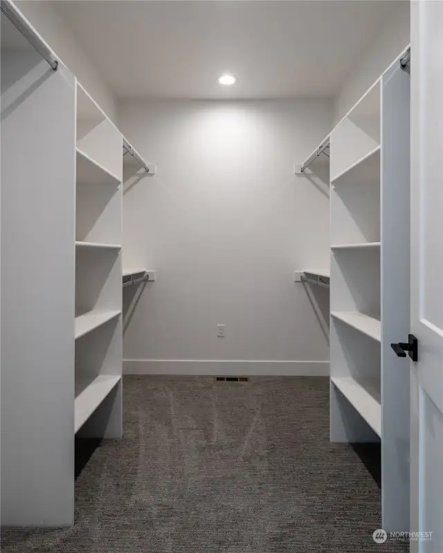 Primary Bedroom features a large En-Suite walk-in closet.