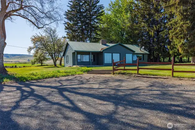 This 1950 rambler guest house offers 2 bedrooms and a full bath, full of character and original charm. Featuring 2 fireplaces—one in the living room with wood and another wood stove in the cozy sitting area. Ample storage space, including attic space and built-ins, makes this home as practical as it is charming.