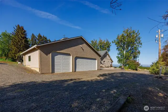 This 3-bay garage includes a practical wash room featuring heat and a slop sink, perfect for cleaning up after outdoor work or projects. A great addition for functionality and convenience!