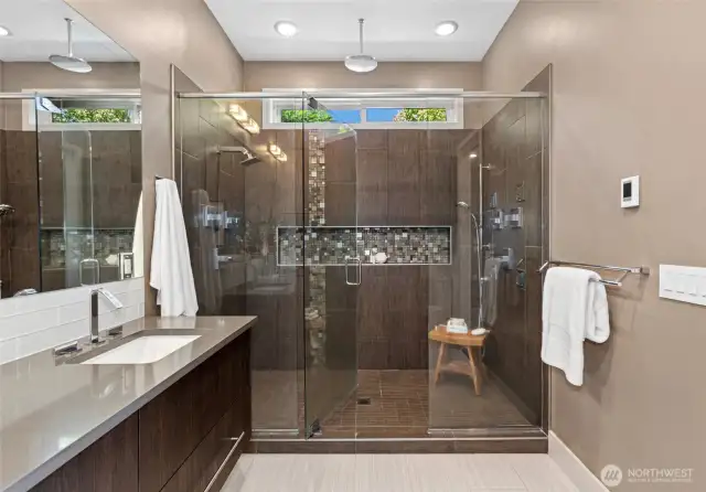 Spa-inspired bath with large walk-in shower and double vanity.