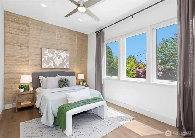 Charming bedroom with designer wallpaper and natural light.