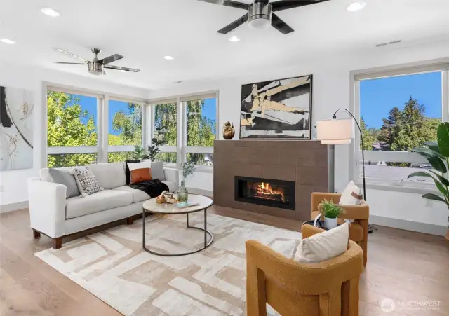 Panoramic windows showcase mountain views.