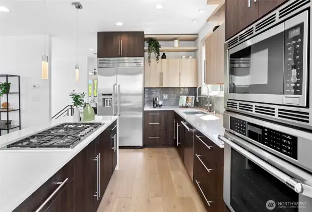 Chef’s kitchen with SS appliances, double oven, and abundant prep space.