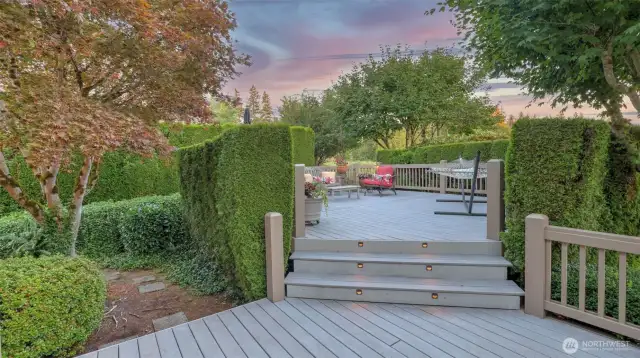 Enjoy your morning coffee on this two-tiered composite deck screened for privacy