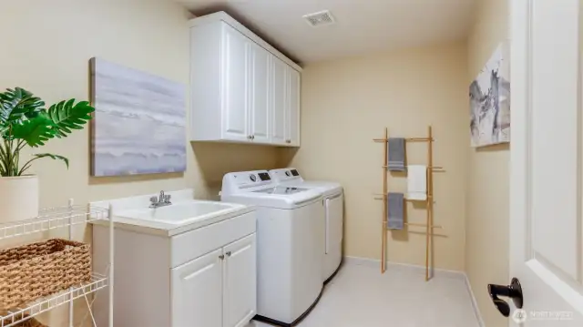 Main floor utility room with storage