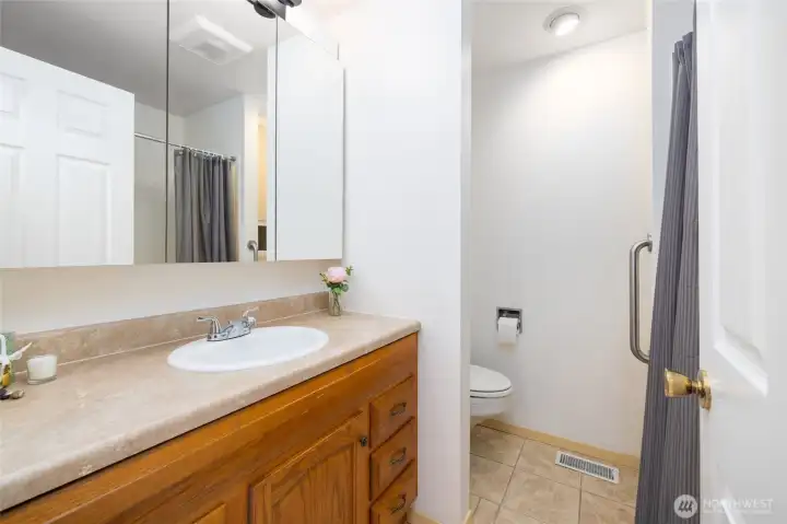 This is the hall bathroom. It is a full bathroom with shower/tub insert and tile floors. New lighting and exhaust fan.