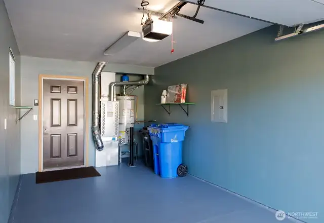 Garage with newer furnace and new hot water heater