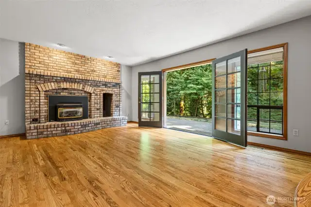 Spacious family room, intricate brickwork, gas insert, and French doors to the patio
