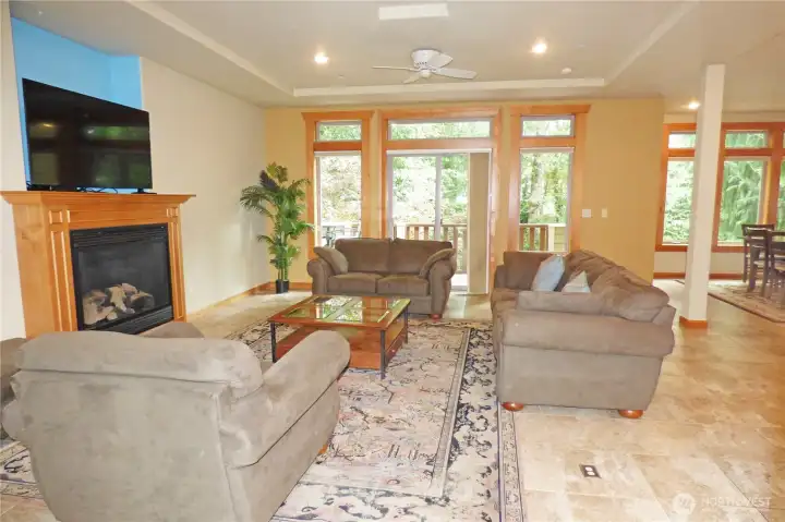 Another view of living room through to the front deck. Note the floor outlets.