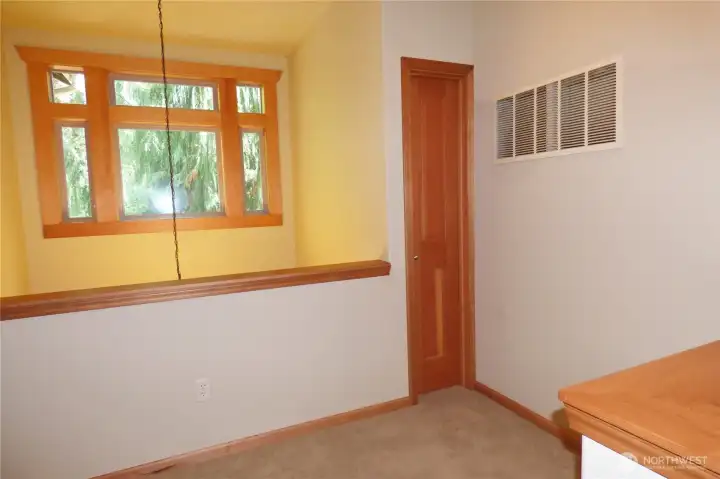 Landing at the top of the stairs overlooking the front door. Small closet for small items or small 'fort'.